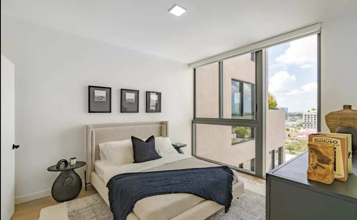 Bright furnished bedroom in a modern South Florida apartment